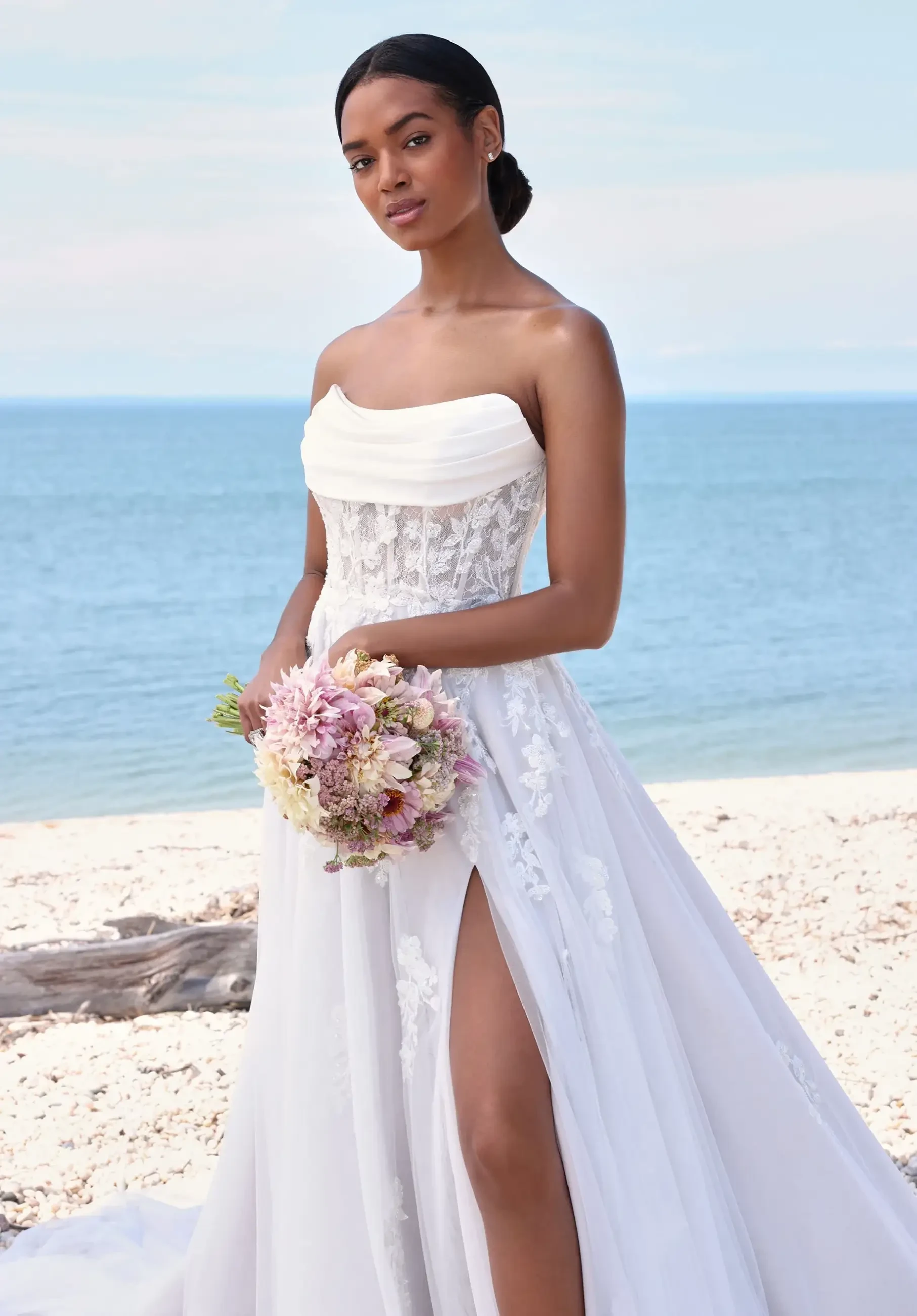 model is wearing a strapless a-line wedding dress