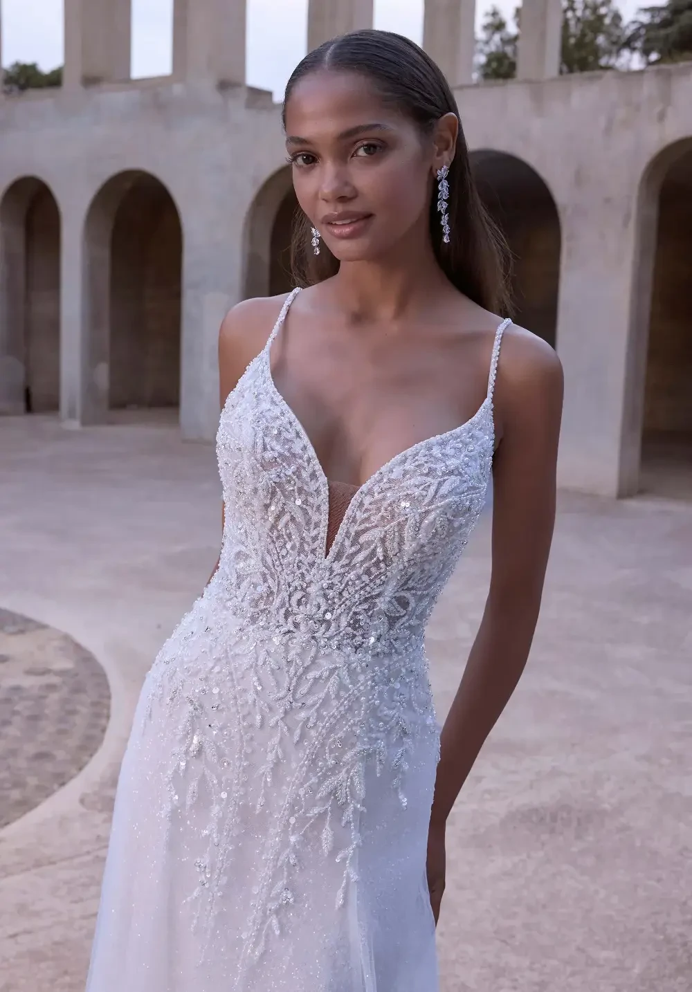 model is wearing a v-neck bridal gown
